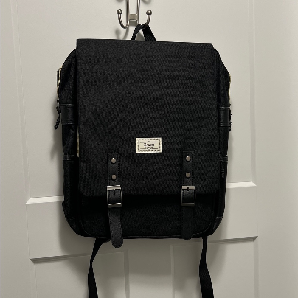 Ronyes vintage laptop backpack, a popular casual daypack for school, work, and t
